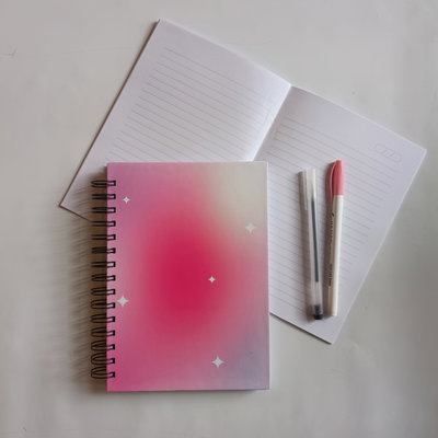 Cuaderno tapa dura gradiente + tapa blanda grilla y biromes ( Rosa )  
