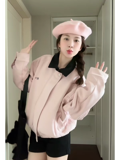 Campera color rosa con cuello negro 