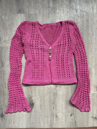 pink crochet cárdigan