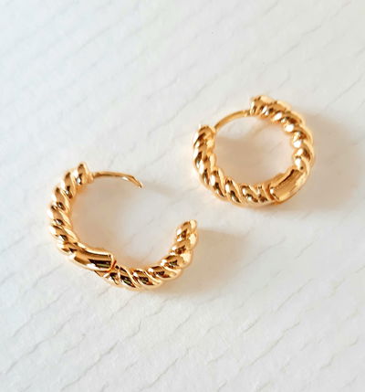 Aros argolla trenzada oro 18 k