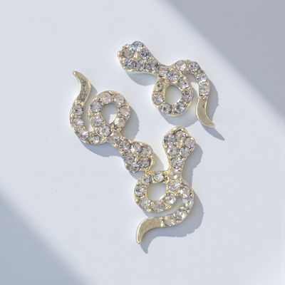 Dije par Serpiente con Cristales Oro aplique