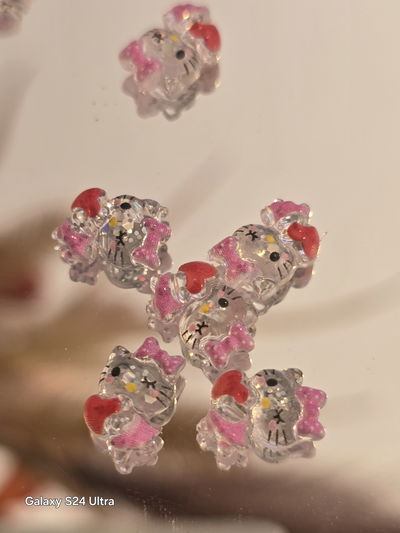 Dije aplique Hello Kitty cristal guiño unidad