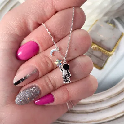 CONJUNTO ASTRONAUTA CON CUBIC Y CRISTAL
