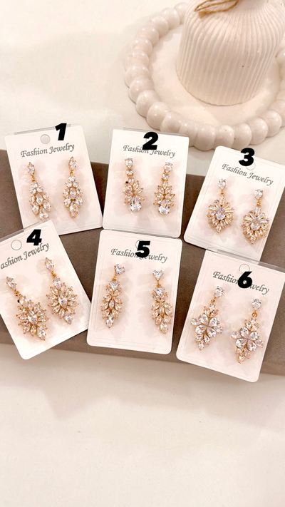 Aros Dorados con Gemas Plateadas