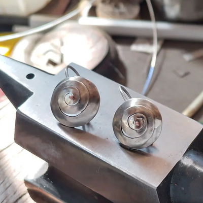 Caracolitos de alpaca con punto de cobre + plata 925 - A Pedido-