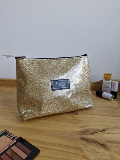 Porta cosméticos dorado glitter