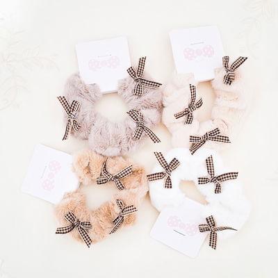 Colitas de peluche con moñitos