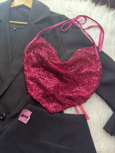 Top lentejuelas fucsia se ata en la espalda