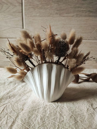Florero ostra Con flores (exclusivo)