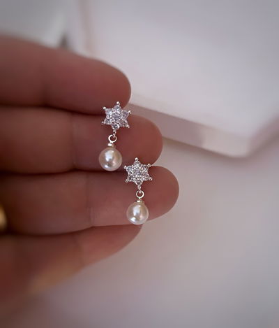 aros estrella y perla plata 925