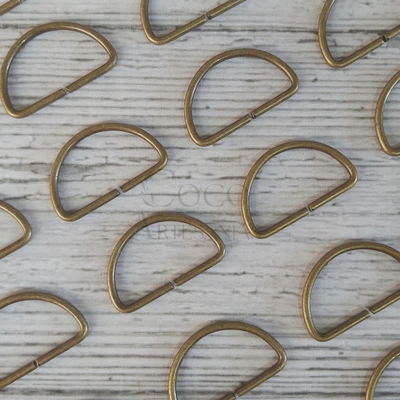 Medialuna de metal 30mm bronce x un.