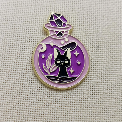 Pin gatito posión