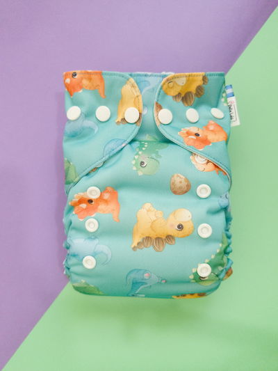 Pañal ecológico "Dinos" multitalle ted de pul importado