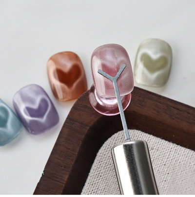 IMAN CAT EYE PATITA GARRA CON ACCESORIO CORAZON