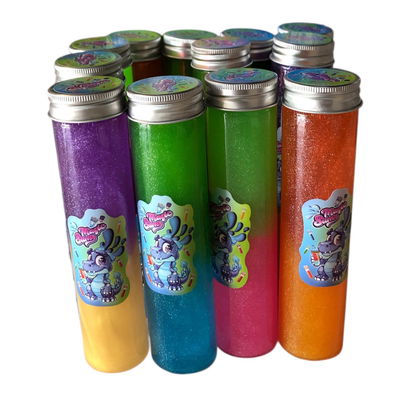 Slime con glitter tubo dino tapa aluminio 15cm aprox.
