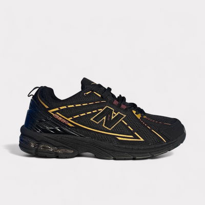 New Balance 1906R Negro/dorado