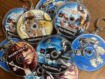 Llaveros discos juegos ps2