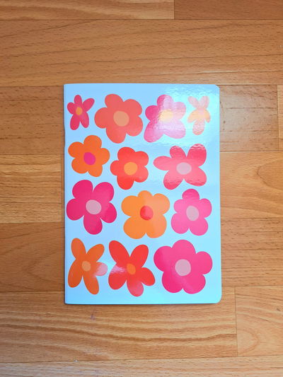Libreta A5 Rayada "Flores Naranjas"