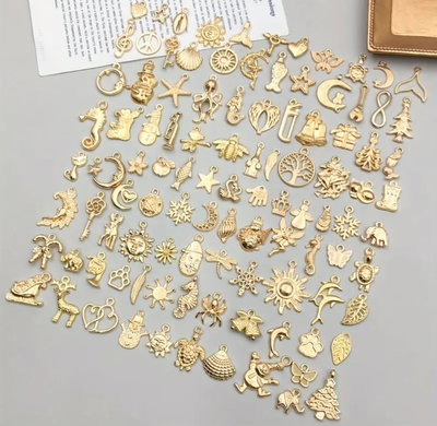 Dijes dorados x 50 unidades (niquel)