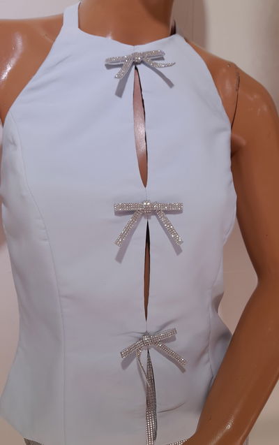 Top cuello alto  c/moño stras