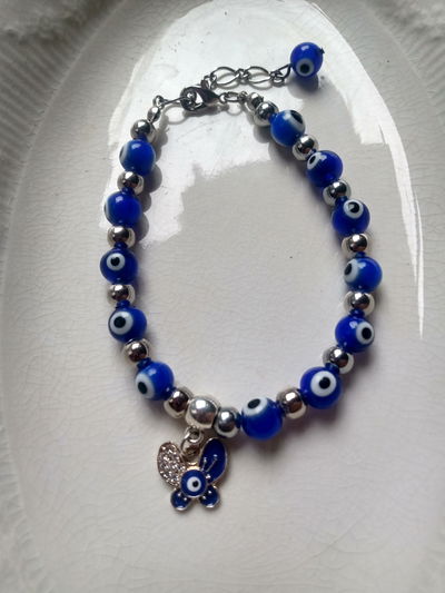 Pulsera mariposa  ojo turco azul con ojos turcos azul