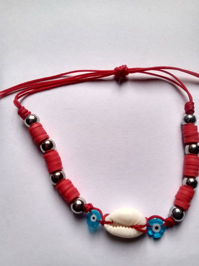 Pulsera caracol con ojos turcos flor