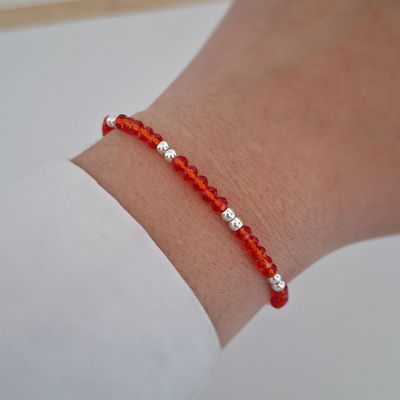 Pulsera bolitas cristal rojo - Ac. Blanco