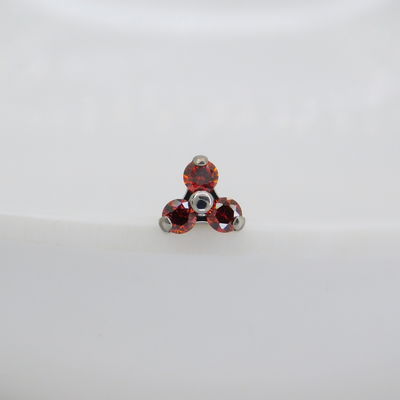 Top triniti zirconitas rojas - Titanio 