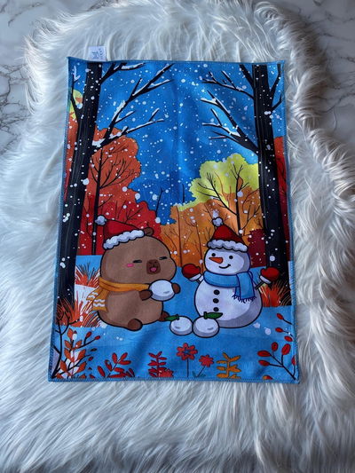 Individual navideño capybara y muñeco de nieve 