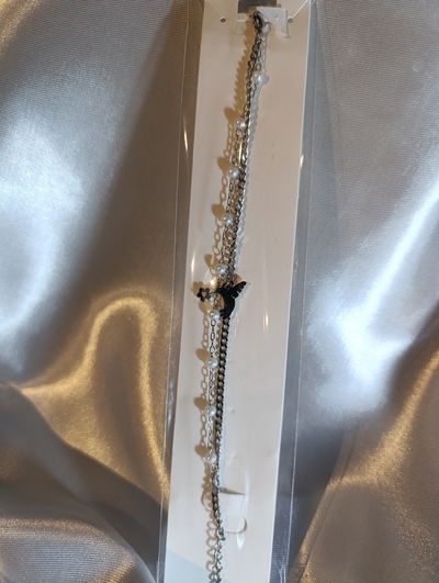 Pulsera acero quirúrgico doble con perlas y dije colibrí 