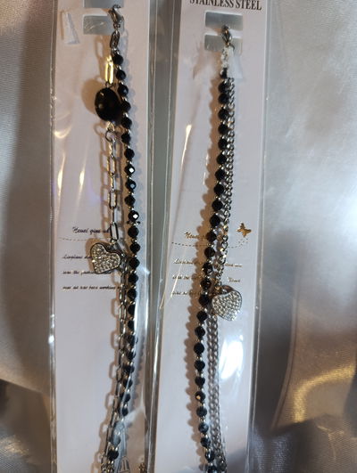 Pulsera acero quirúrgico doble con dije y piedras negras