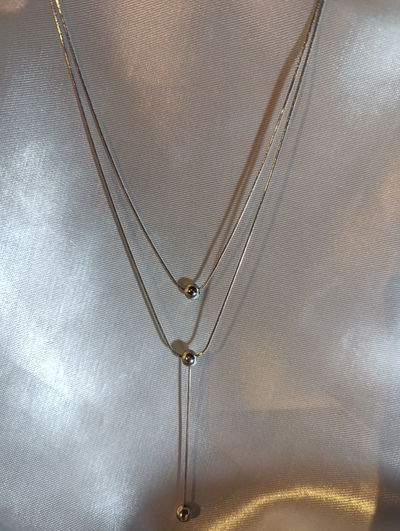 Collar acero quirúrgico cilindrico doble con perlas 