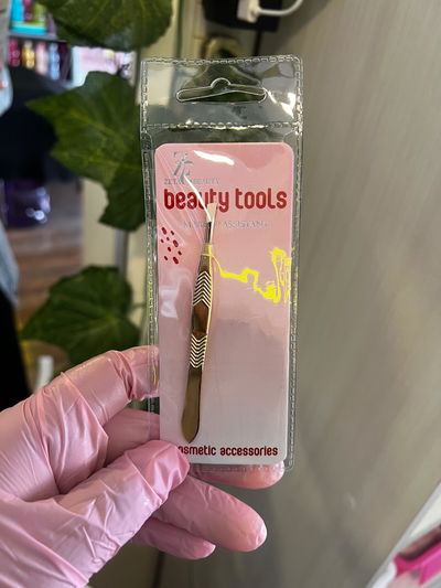 Pinza de depilar dorada