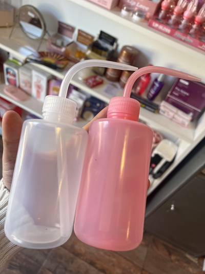 Botella pico blanco transparente