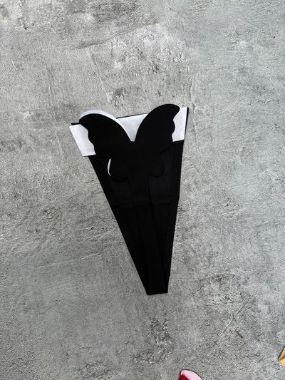Tanga invisible mariposa negro