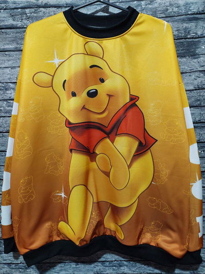 Buzo winnie dorado