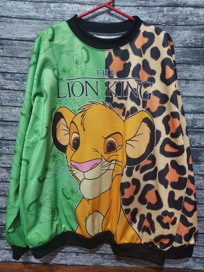 Buzo simba animal print y verde 