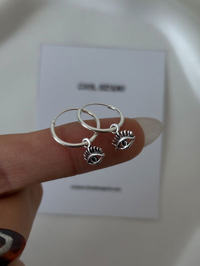 Argollas dijes ojitos (14mm)