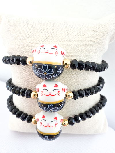 PULSERA - ORO LAMINADO - MANEKI NEKO NEGRA