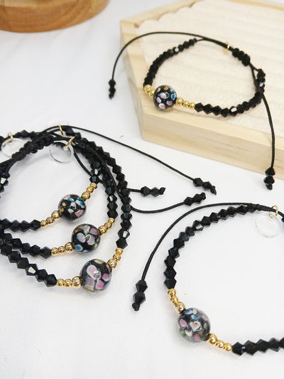 PULSERA - ORO LAMINADO - ESFERA MURANO NEGRA