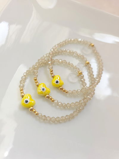 PULSERA - ORO LAMINADO CORAZÓN CERÁMICA AMARILLA 