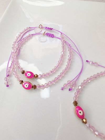 PULSERA - OJITO FUCSIA REGULABLE