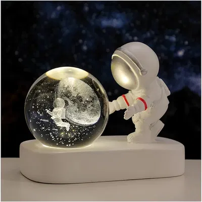 Lámpara velador con bola de cristal y astronauta 