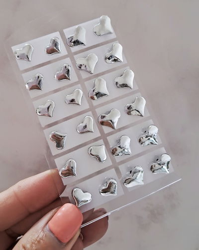 Aros Corazón Blister x12 pares Ac. Quirúrgico 