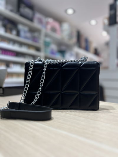 Bandolera con cadenas