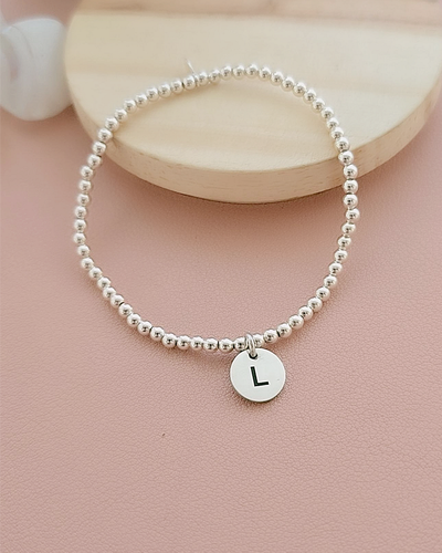 PULSERA ELASTIZADA MEDALLA INICIAL