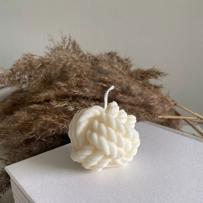 Vela aromática nudo