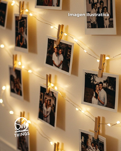 Polaroid con tira de luces y broches