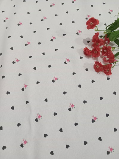 Algodón con lycra "corazón negro con flor f blanco""