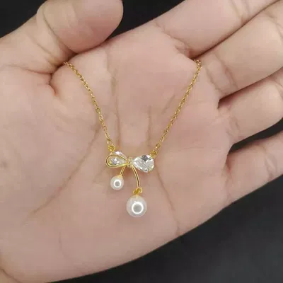 Collar con dije moño con strass y perla acero dorado y plateado